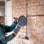 Professional builder work clothes works with cutting tool 150x150